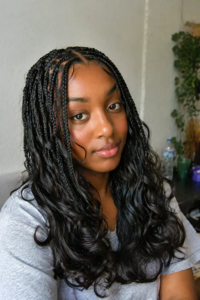 a girl wearing t-shirt has Fulani Braids with Glam Waves Combo hairstyle 