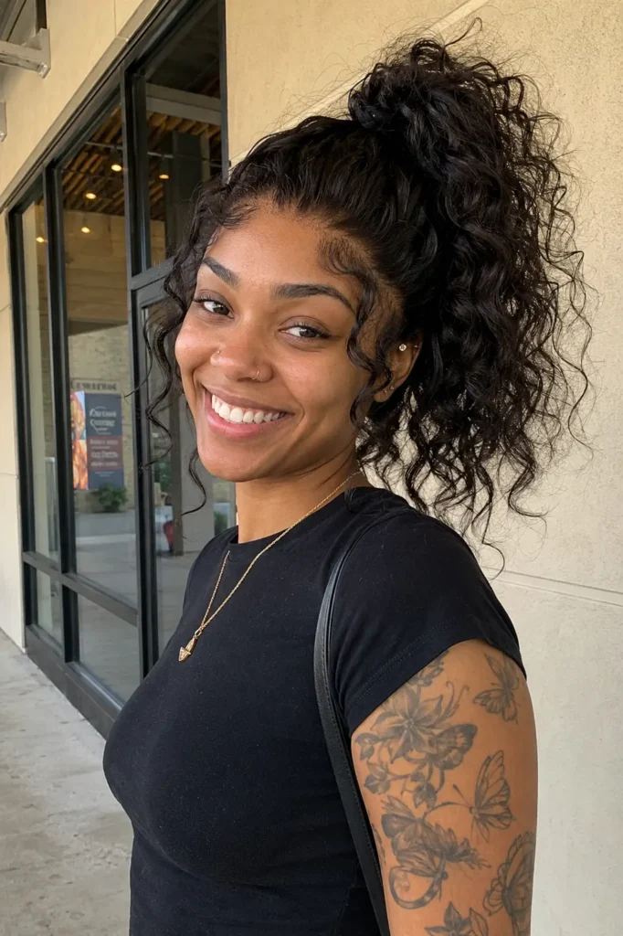 girl aged 22–28 with a messy curly quick weave ponytail featuring soft, loose curls and natural volume