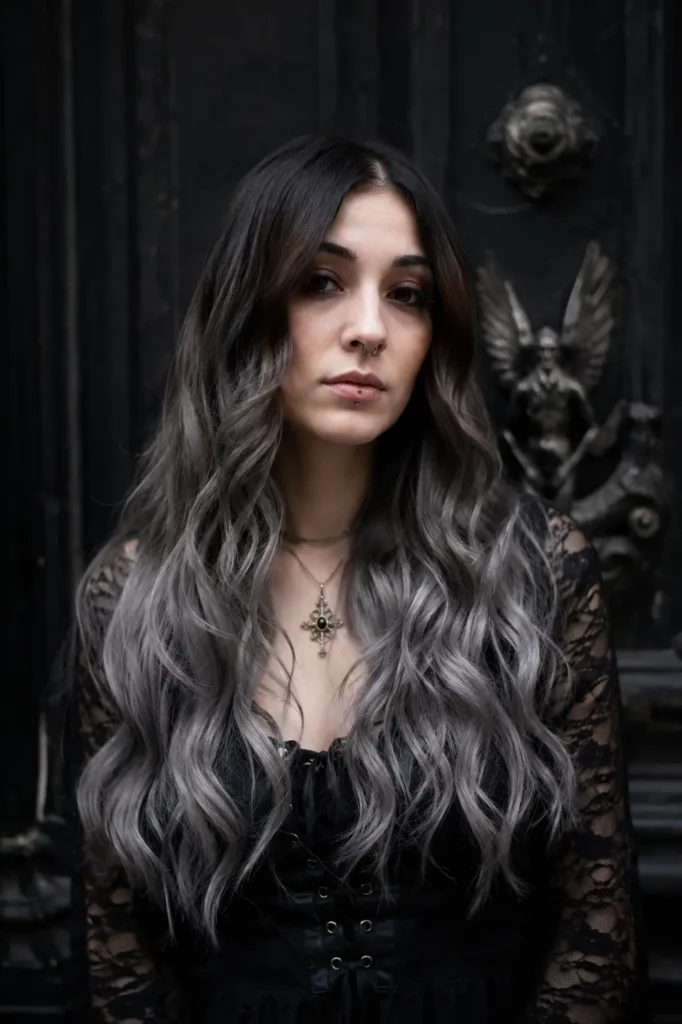 young woman with a thick side braid and dark romantic waves in a gothic witch aesthetic, wearing a black velvet outfit in a warm candlelit room