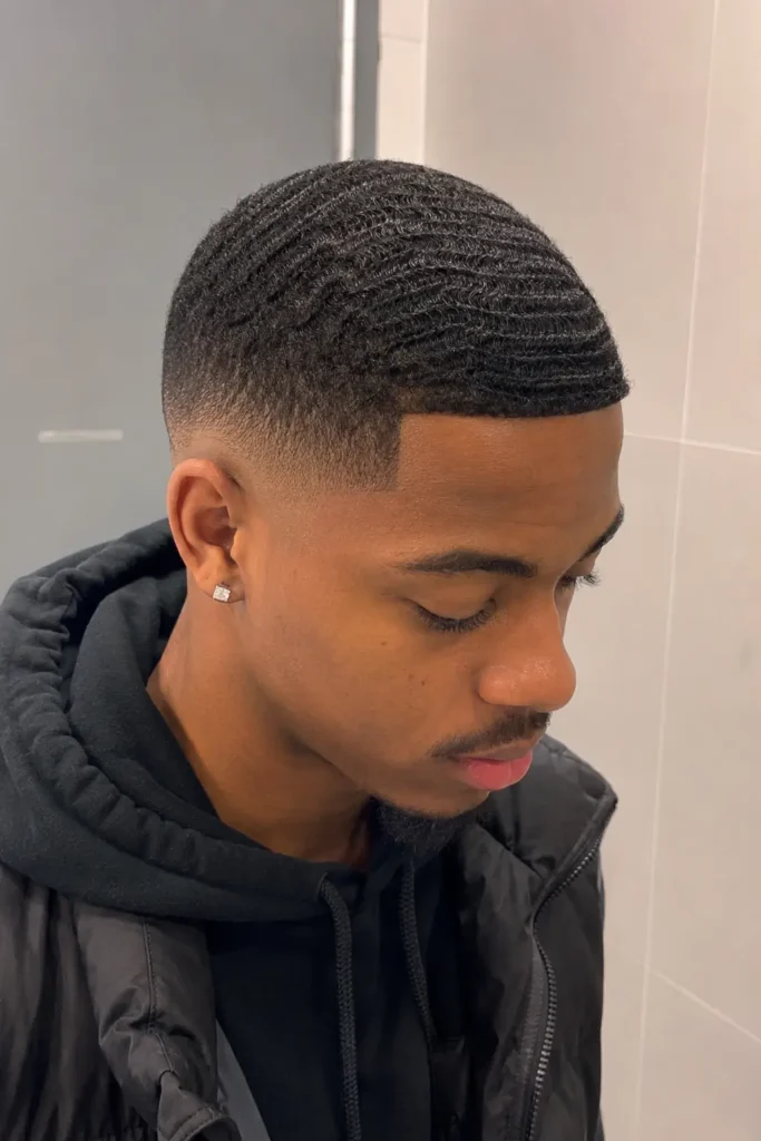 young man with a temple fade and deep 360 wave hairstyle, featuring realistic skin texture, natural facial features
