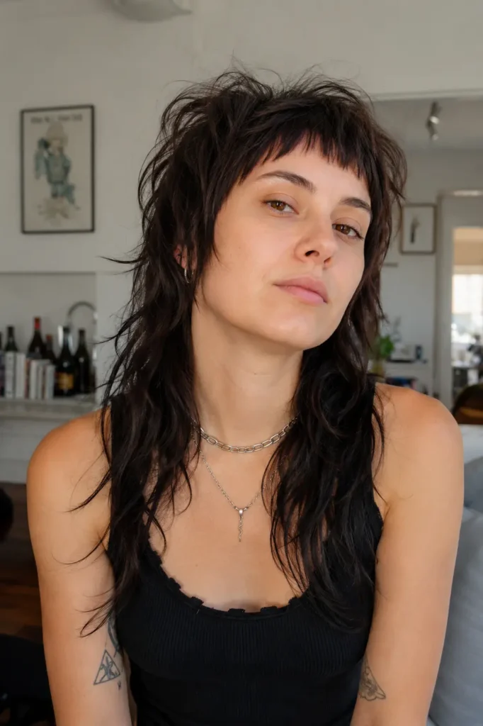 a photorealistic wolf cut hairstyle featuring ultra-short micro bangs, choppy textured layers, and messy crown volume