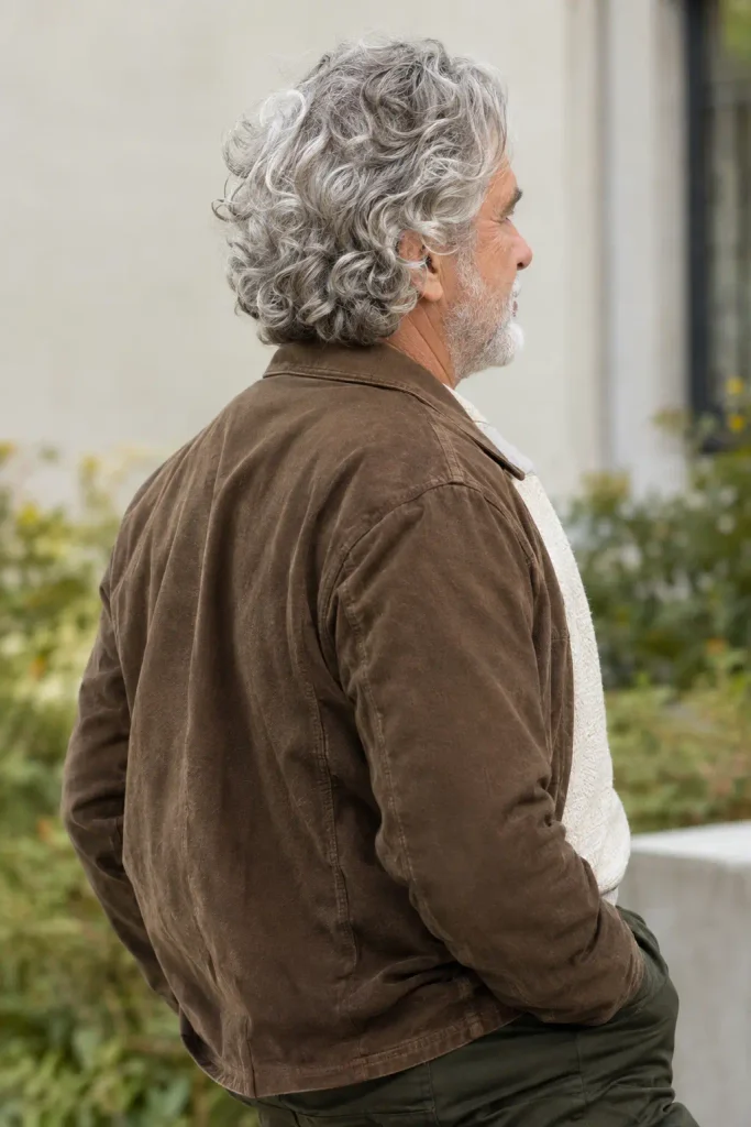 Soft medium-length curls among natural Hairstyles for Men Over 60.